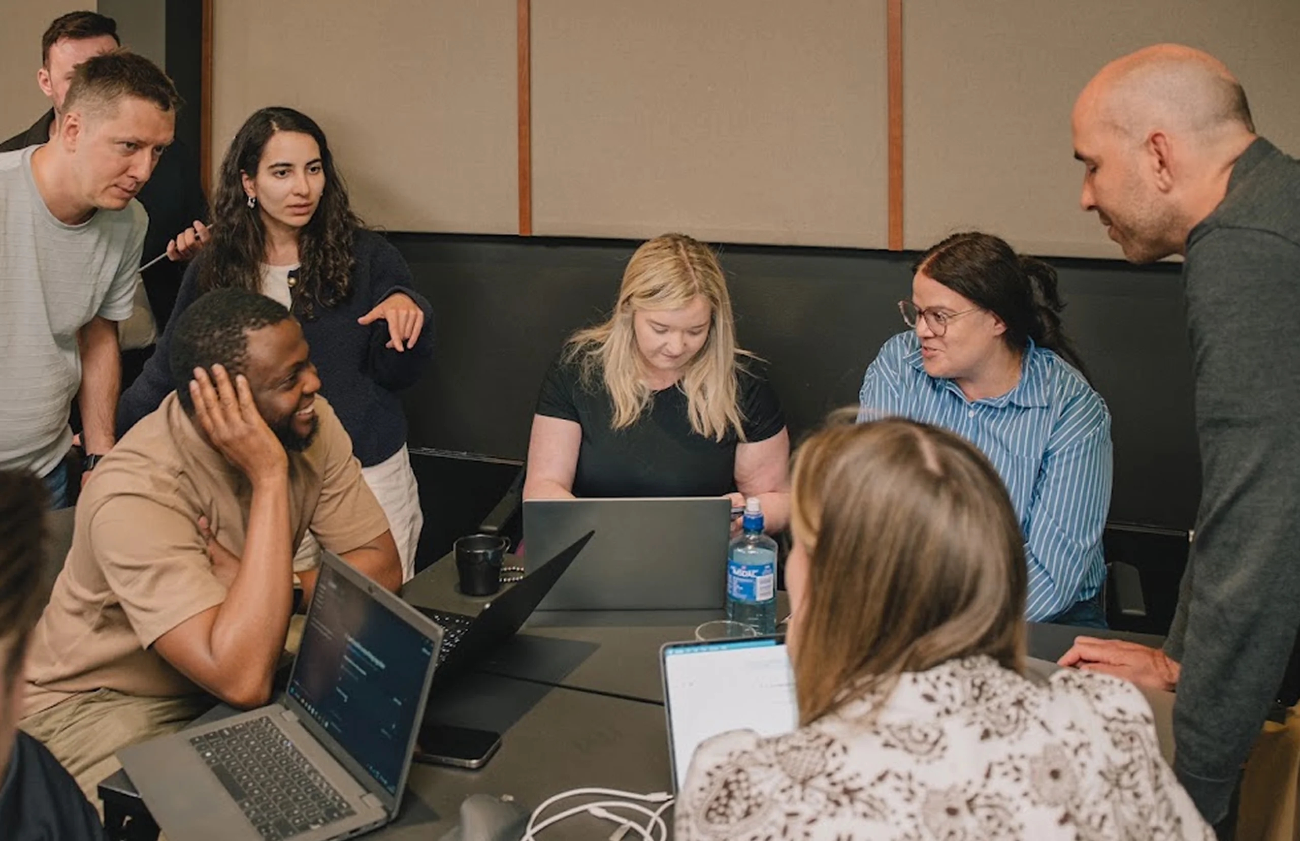 LemFi teammates working together around a shared desk